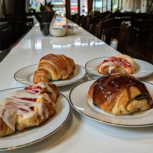 Excelsior Boulangerie dessert feature photo of four desserts